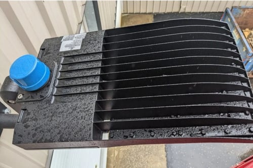 LED flood lights exposed to rain and humidity showing weather impact on outdoor fixtures