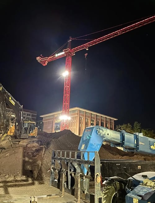 LED contractor lights installed on construction site exterior wall