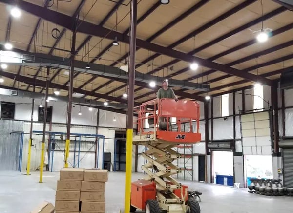150-watt commercial LED high bay UFO fixture installed in warehouse