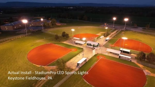 LED baseball field lights installed near baseline