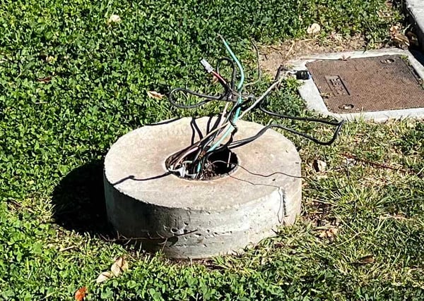 Broken and rusted-out direct burial light pole