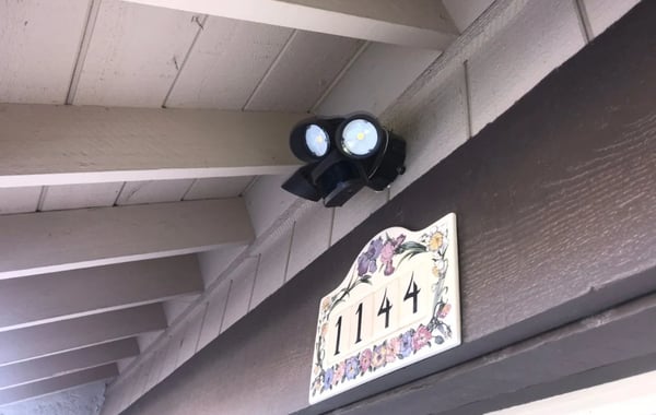 LED motion sensor wall light mounted on a commercial building exterior wall