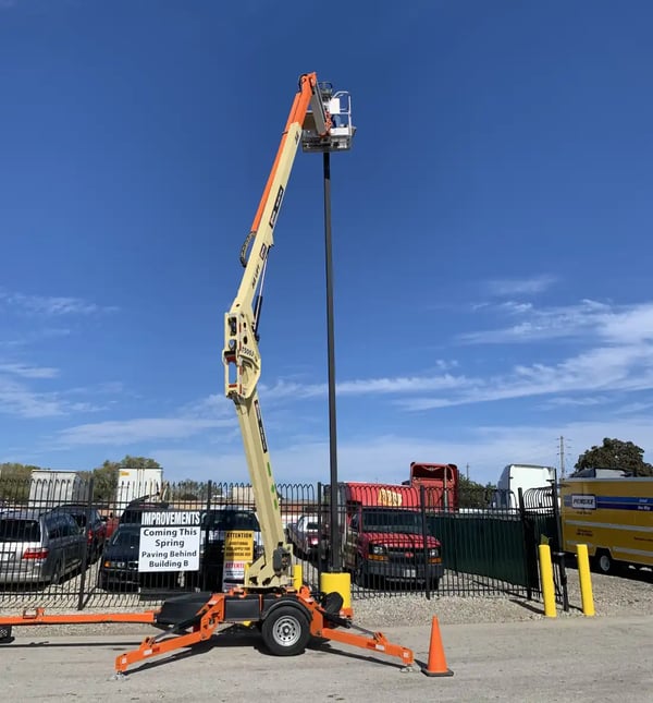 LED parking lot lights being installed with a crane