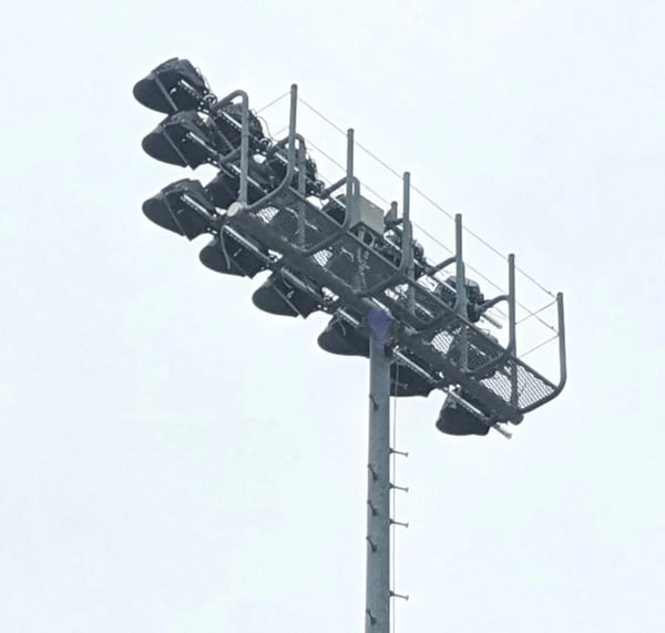 High voltage stadium lights installed at sports facility