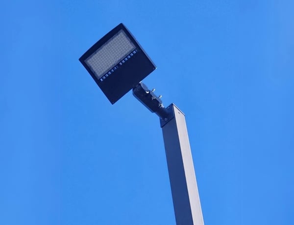 LED street light fixture mounted on a pole at night