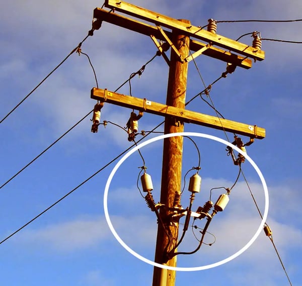 lightning surge arrestors on a utility pole