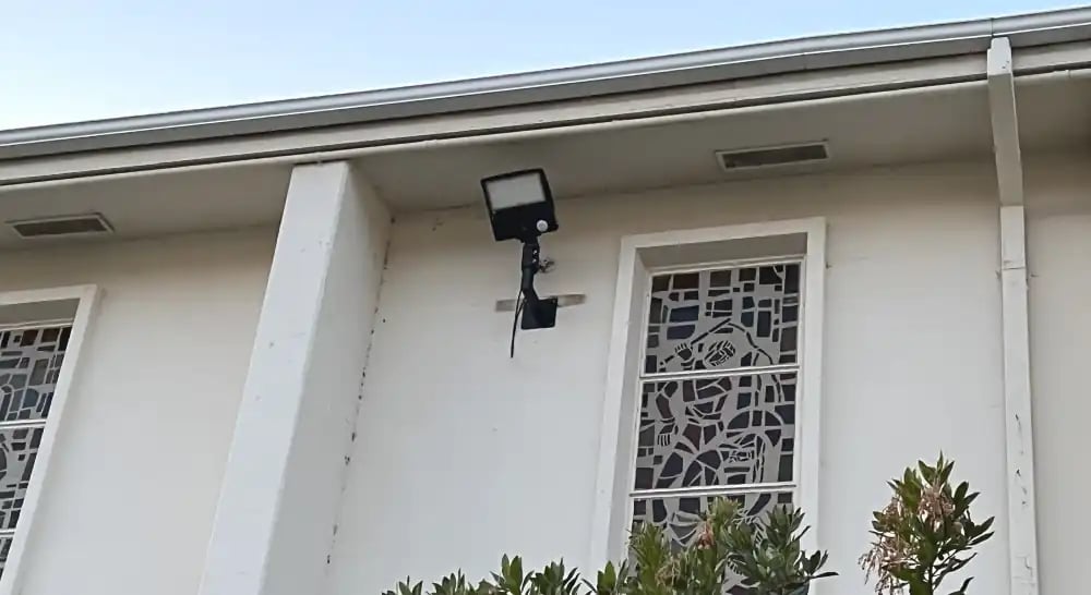 LED motion sensor wall light installed on church building